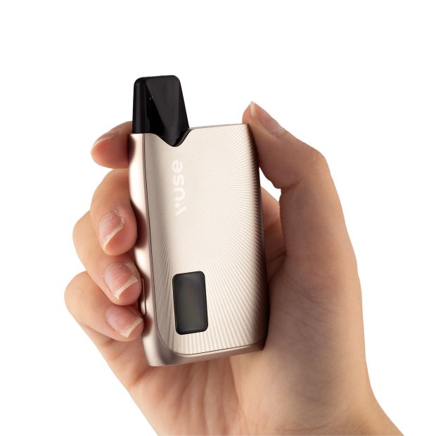 A rose gold Vuse Ultra kit held in someone's hand