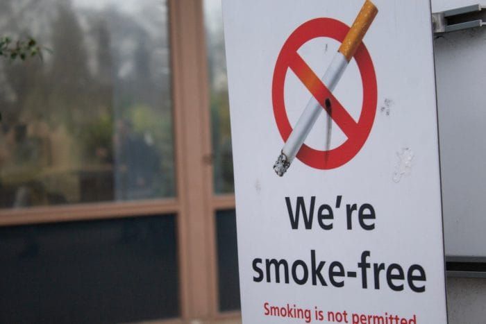 A sign saying "We're smoke-free" outside St Thomas' Hospital