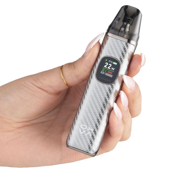 A silver OXVA XLIM Pro 2 pictured in somebody's hand on a white background