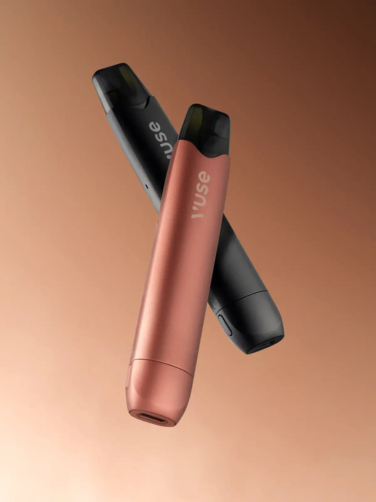 Two Vuse Go Reload 1000 Pen kits, one black and one rose gold, floating side by side on a brown background