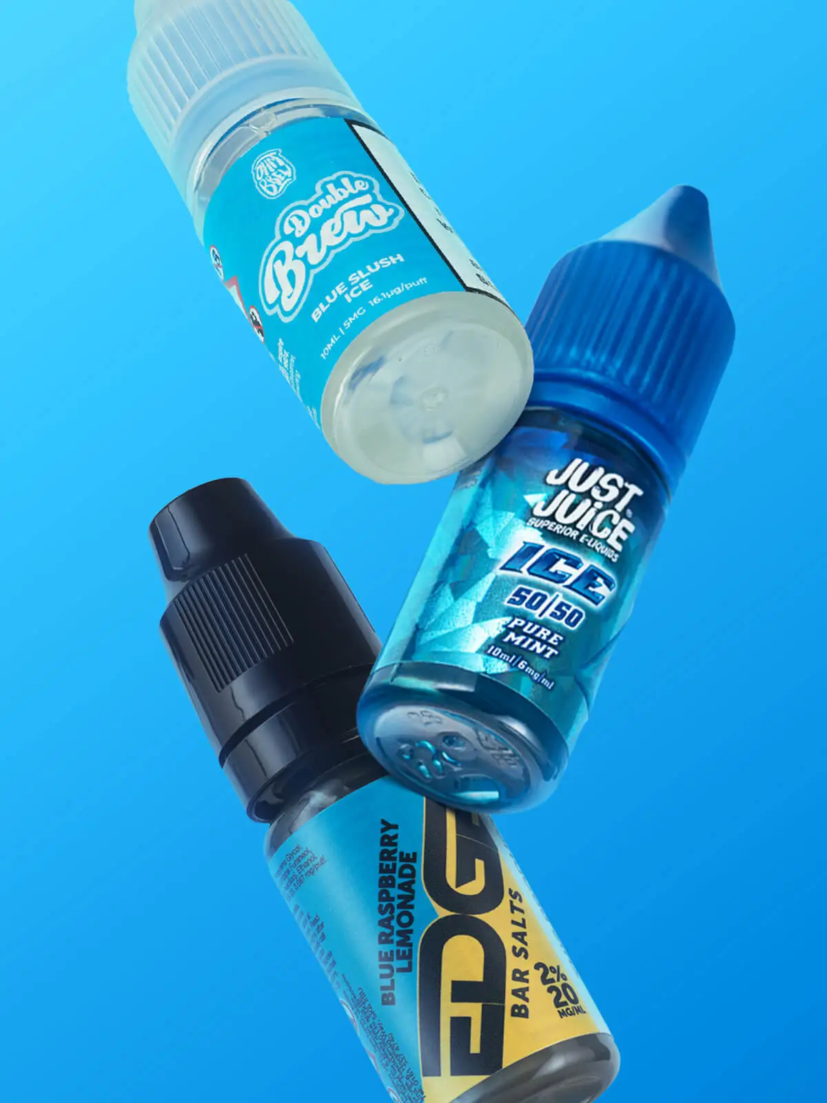 Three bottles of e-liquid; Ohm Brew Double Brew, Juice Juice Pure Mint and Edge Blue Raspberry Lemonade, floating in front of a blue background