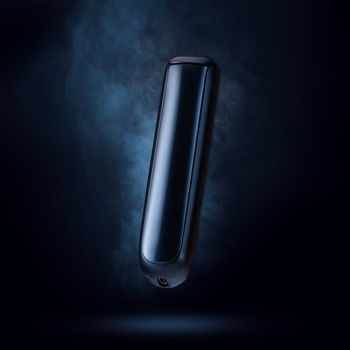 A navy blue Ploom Aura device floating on a stylised, navy blue background, with plumes of smoke cascading behind the device for dramatic effect