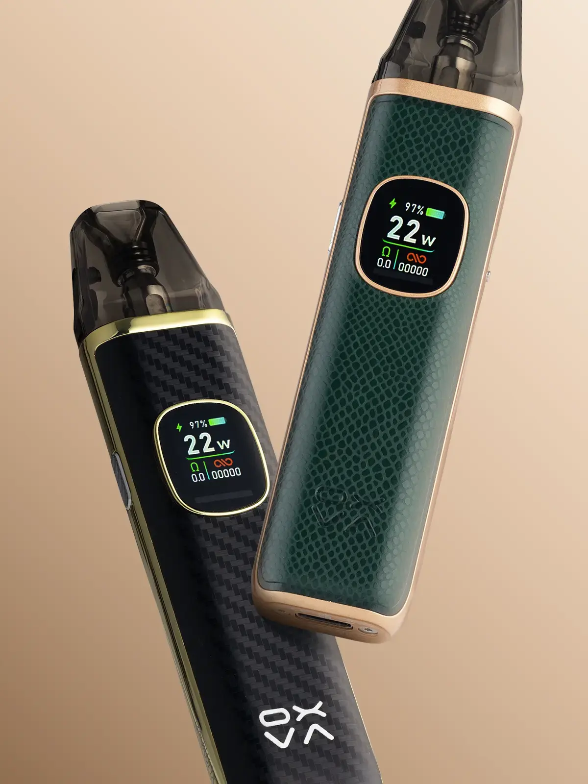 One green OXVA XLIM Pro 2 kit and one black OXVA XLIM Pro 2 kit, floating side by side on a beige background.