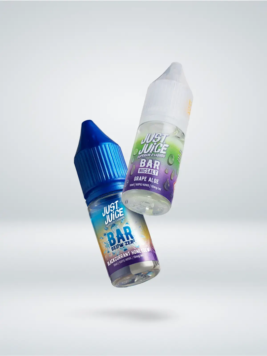 One Just Juice Grape Aloe bar salt bottle, and one Just Juice Below Zero Blackcurrant Honeydew bar salt bottle floating side by side on a white background